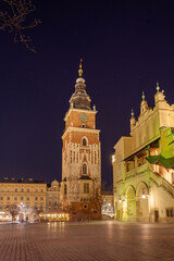 Fototapeta na wymiar Old town square in Krakow at night, Poland. St. Marys Basilica