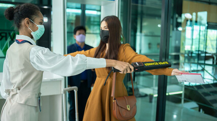..businesswoman undergoing security check before the flight. Concept of airport Security...