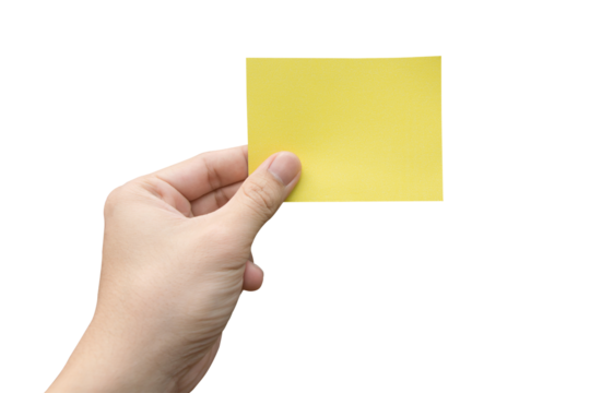 Hand holding yellow paper isolated on white with clipping path.
