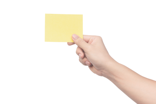 Hand holding yellow paper isolated on white with clipping path.