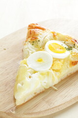 Piece of hard boiled egg pizza with copy space 