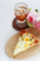 Piece of hard boiled egg pizza with copy space 