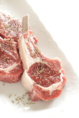 Raw lamb chop and herbal for gourmet cooking image