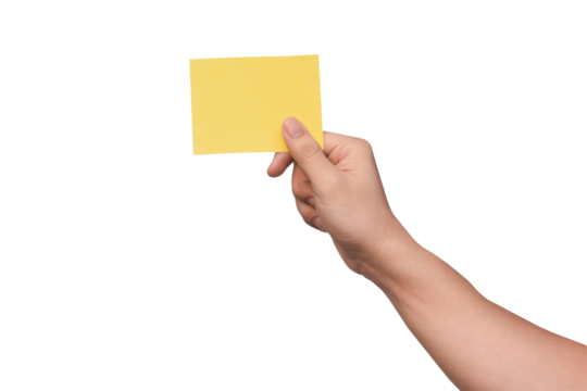 Hand holding yellow paper isolated on white with clipping path.