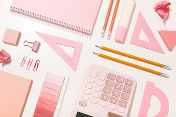 school supplies in pink colors on a white background. Preparation for school