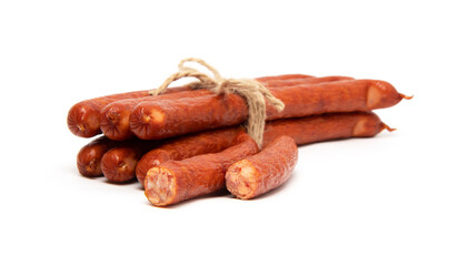 Smoked grilled thin Pork Sausages, close-up, isolated on white background