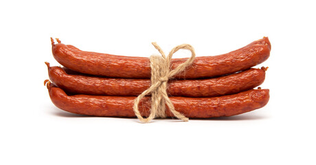 Smoked grilled thin Pork Sausages, close-up, isolated on white background