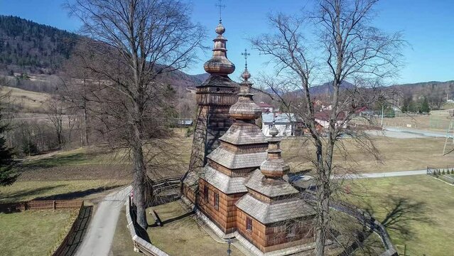 St. Paraskevi wooden church in Kwiatoń, Poland.  Built in 17th century. Originally an eastern orthodox church (tserkva), now a Roman Catholic church. UNESCO World Heritage Site. Aerial video
