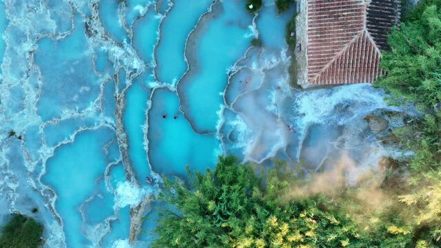 View from above, stunning aerial view of Le Cascate del Mulino, a group of beautiful hot springs in the municipality of Manciano, Tuscany