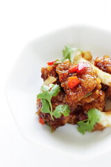 Chinese food, sour and sweet chicken with coriander leaves 