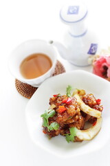 Chinese food, sour and sweet chicken with coriander leaves 