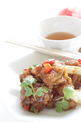 Chinese food, sour and sweet chicken with coriander leaves 