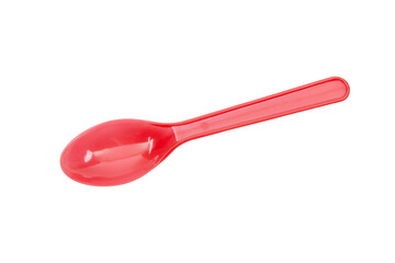 Red plastic spoon isolated on white background.