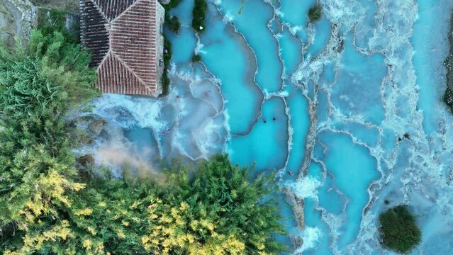 View from above, stunning aerial view of Le Cascate del Mulino, a group of beautiful hot springs in the municipality of Manciano, Tuscany