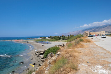 Fototapeta na wymiar Frangokastello beach, Crete. A long sandy beach in front of Venetian castle. Sfakia district, region of Chania 