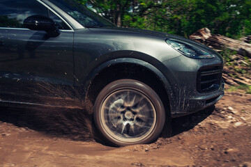 Fototapeta na wymiar Off road car close up at the mud 