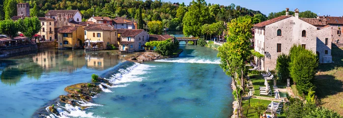 Poster Borghetto sul Mincio - one of the most beautiful medieval villages of Italy. colorful houses located in the middle river and waterfalls. Verona province, near Garda Lake © Freesurf