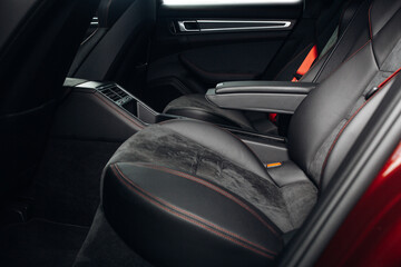 Fototapeta na wymiar Luxury car rear seats row. Expensive car leather seats. Cozy and comfortable seats of vip transfer car 