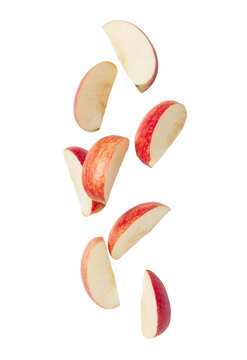 Cutout of falling red apple slice.