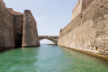 Fototapeta premium View from a tourist boat of the Royal Walls of Ceuta and its navigable moat