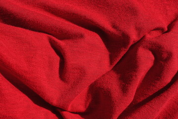 red texture from a piece of crumpled fabric on old clothes