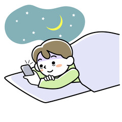 夜中に布団の中でスマホを見て夜更かしする若い男性