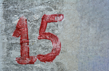 Number 15 On Concrete Wall