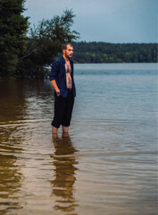 a series of photographs of a man barefoot near the water in the evening