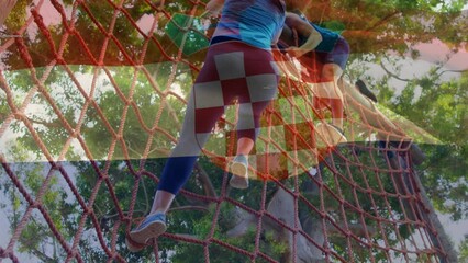 Animation of flag of croatia over diverse woman and man during obstacle race training - Powered by Adobe