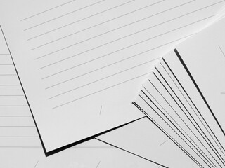 pile of white paper sheet with lined, texture background