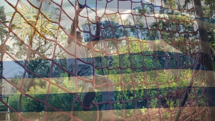 Animation of flag of argentina over caucasian woman during obstacle race training - Powered by Adobe