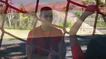 Animation of flag of netherlands over caucasian man and boy during obstacle race training - Powered by Adobe