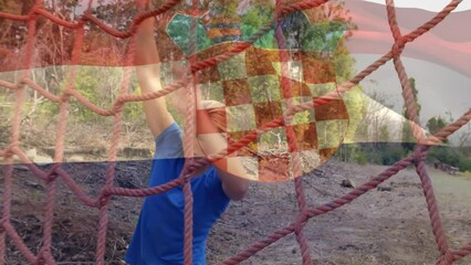 Animation of flag of netherlands over caucasian woman during obstacle race training - Powered by Adobe