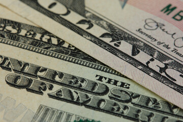 Dollar background. Fragments of American currency banknotes. Selective focus