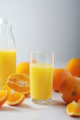 Oranges and orange juice in glasses