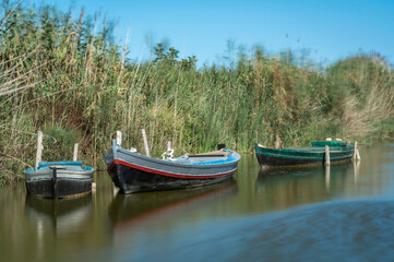 Naklejka na ściany i meble Fishing traditional wood boats in the lake.