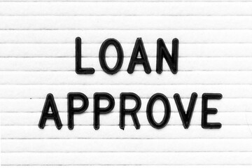 Black color letter in word loan approve on white felt board background