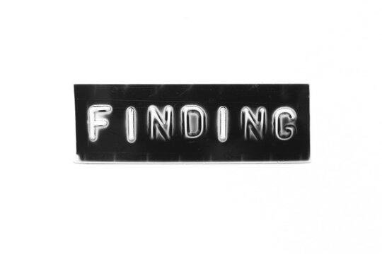 Black color banner that have embossed letter with word finding on white paper background