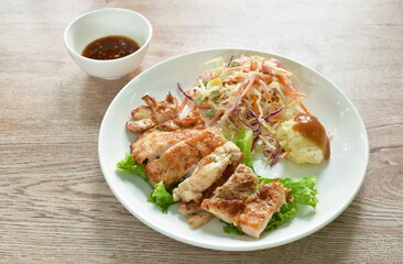 grilled chicken black pepper steak dipping spicy sauce with mashed potato dressing gravy and salad on plate 