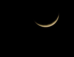Obraz na płótnie Canvas crescent moon against black night sky background