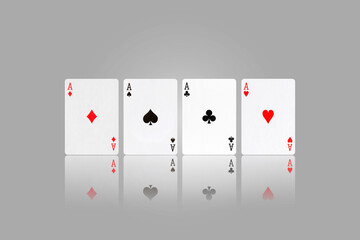 Four Ace. Playing cards on a gray background. Reflection. Gambling.