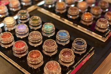 Multicolored eye shadow. Cosmetics store