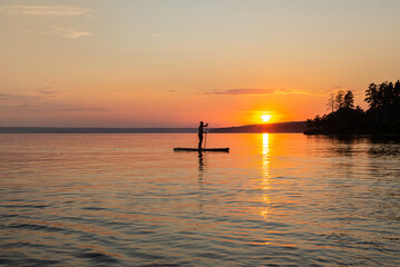 Fototapeta na wymiar Sunset over the lake. Summer evening