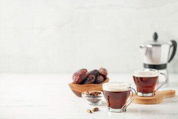 Cup with dates coffee  with date seeds. Healthy plant drink for immunity. Coffee alternatives