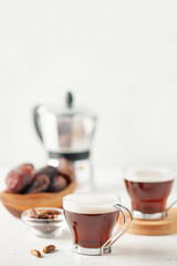 Cup with dates coffee  with date seeds. Healthy plant drink for immunity. Coffee alternatives