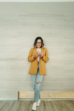 Businesswoman reading a text message on her smartphone