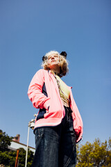 Gender fluid nonconformist rebel afab outdoor posing looking over