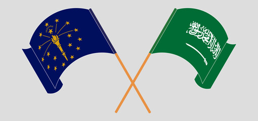 Crossed and waving flags of the State of Indiana and Saudi Arabia