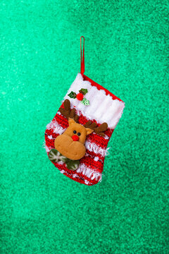 Christmas stocking on green background