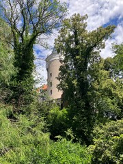 Fototapeta na wymiar Tower of Zleby Castle in Czech Republic from the park